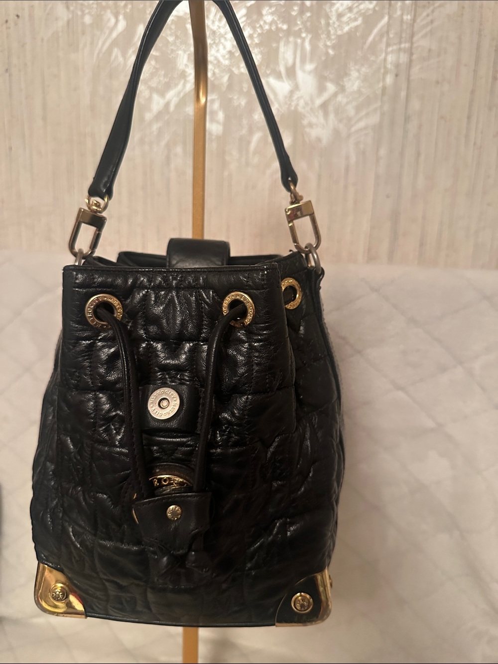 Black Quilted Drawstring Shoulder Bag with Gold Hardware